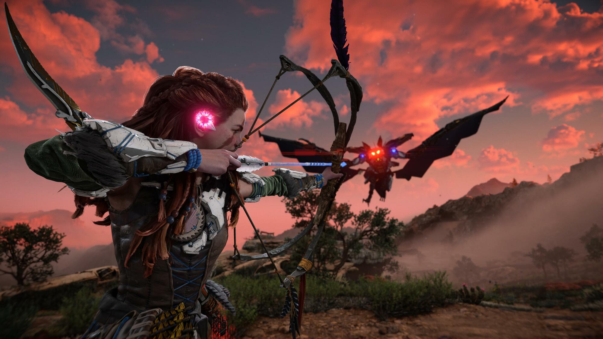 A screenshot from "Horizon Forbidden West." Aloy aims a shot at a large, flying robot that looks like a giant-sized bat.