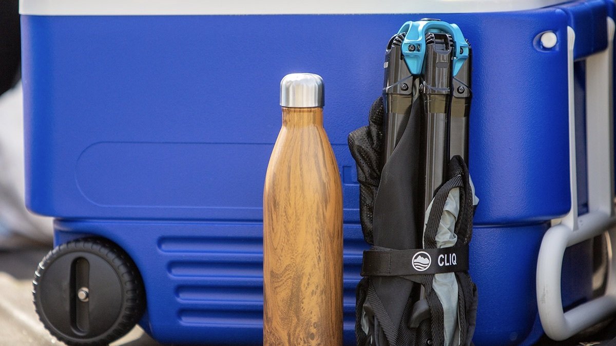 2-pack of CLIQ Portable Camping Chairs collapsed against a cooler.