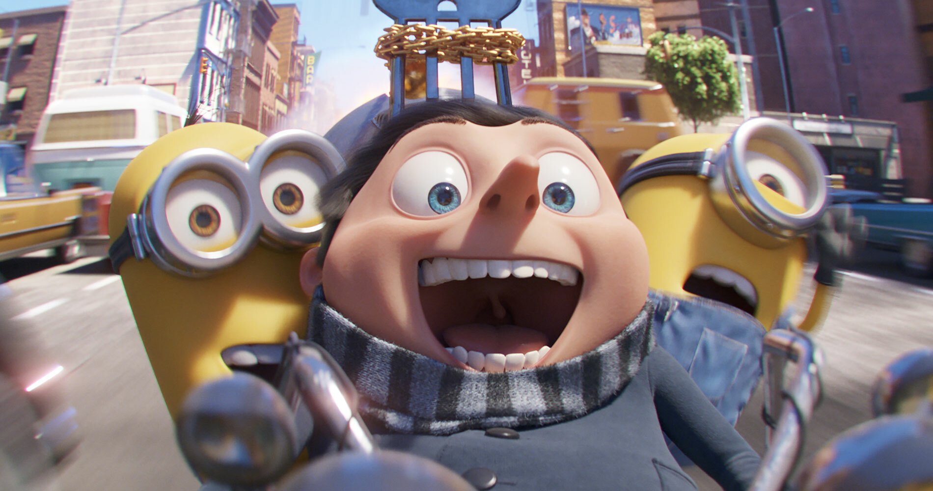 Gru alonside two of the titular minions riding down a city street at high speeds