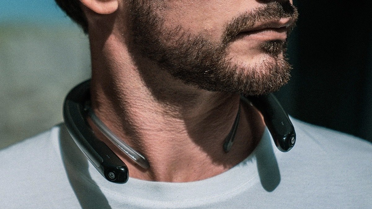 Person wearing the FITT360: Hands-Free Neckband Camera.