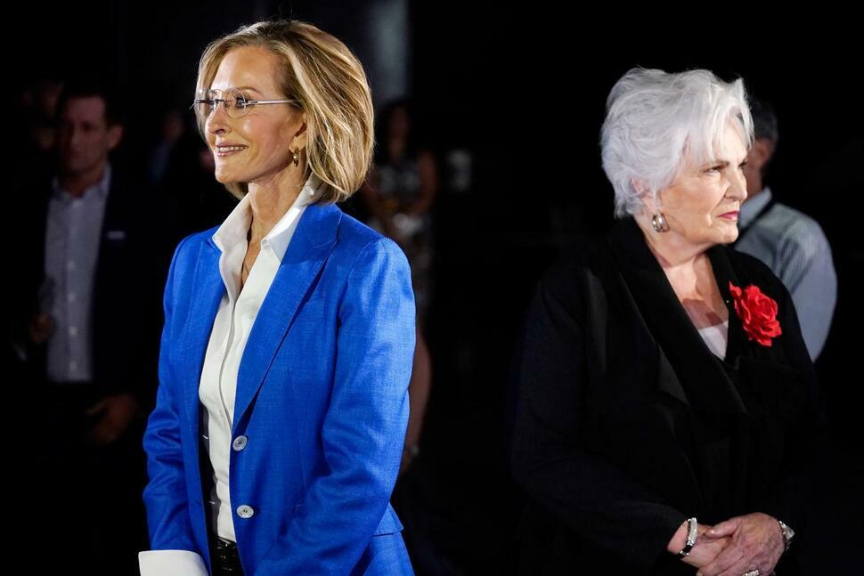 Republican candidates for Arizona governor Karrin Taylor Robson, left, and Paola Tulliani-Zen, right, arrive on the set prior to a PBS televised debate