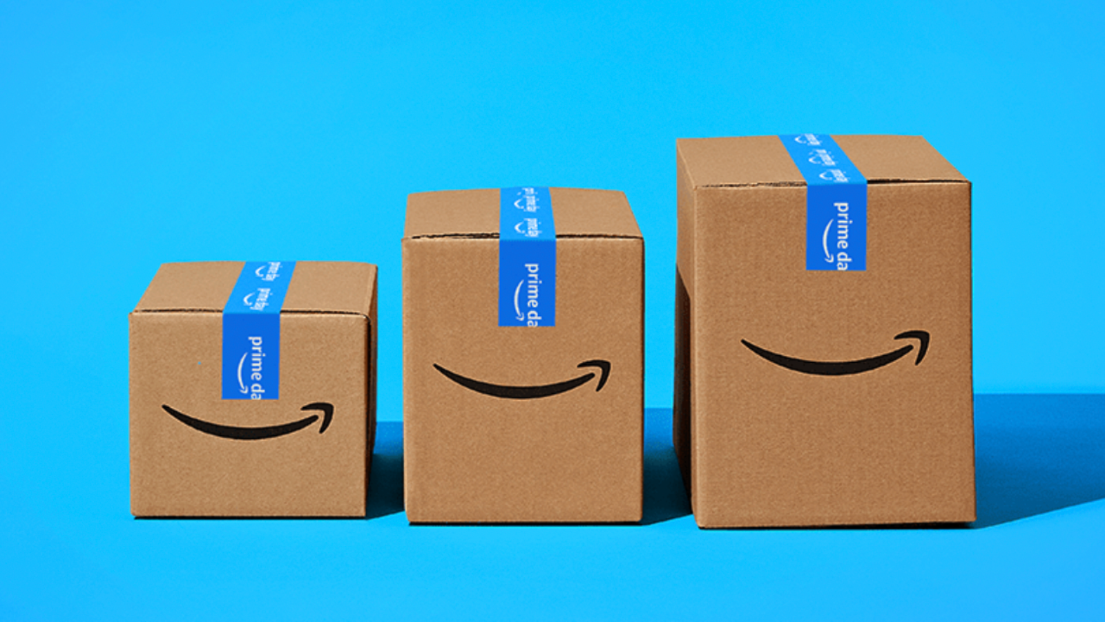 three amazon boxes lined up in order from smallest to largest against an aqua background