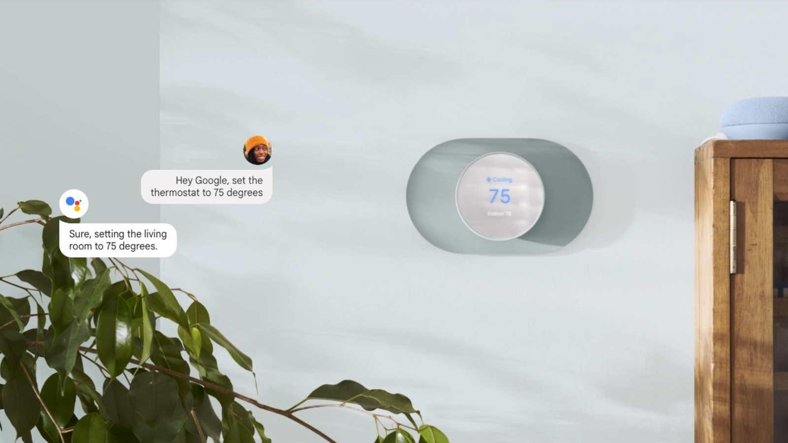 google nest thermostat on wall with google voice assistant speech bubbles