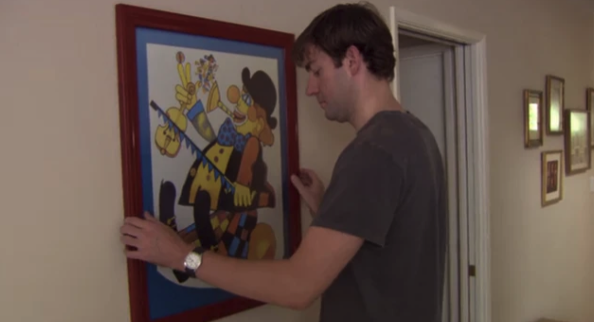 Jim tries to move the clown painting, to no avail.