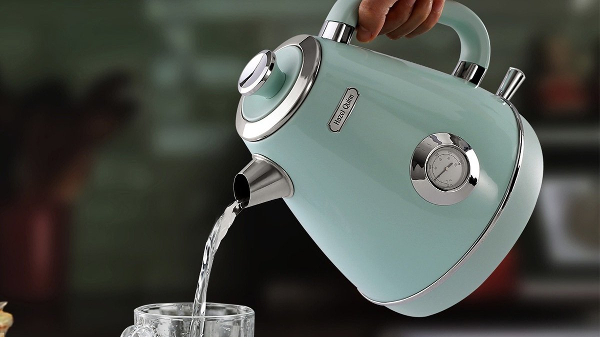Someone pouring tea out of the Hazel Quinn Retro Style 1.7L Electric Kettle.