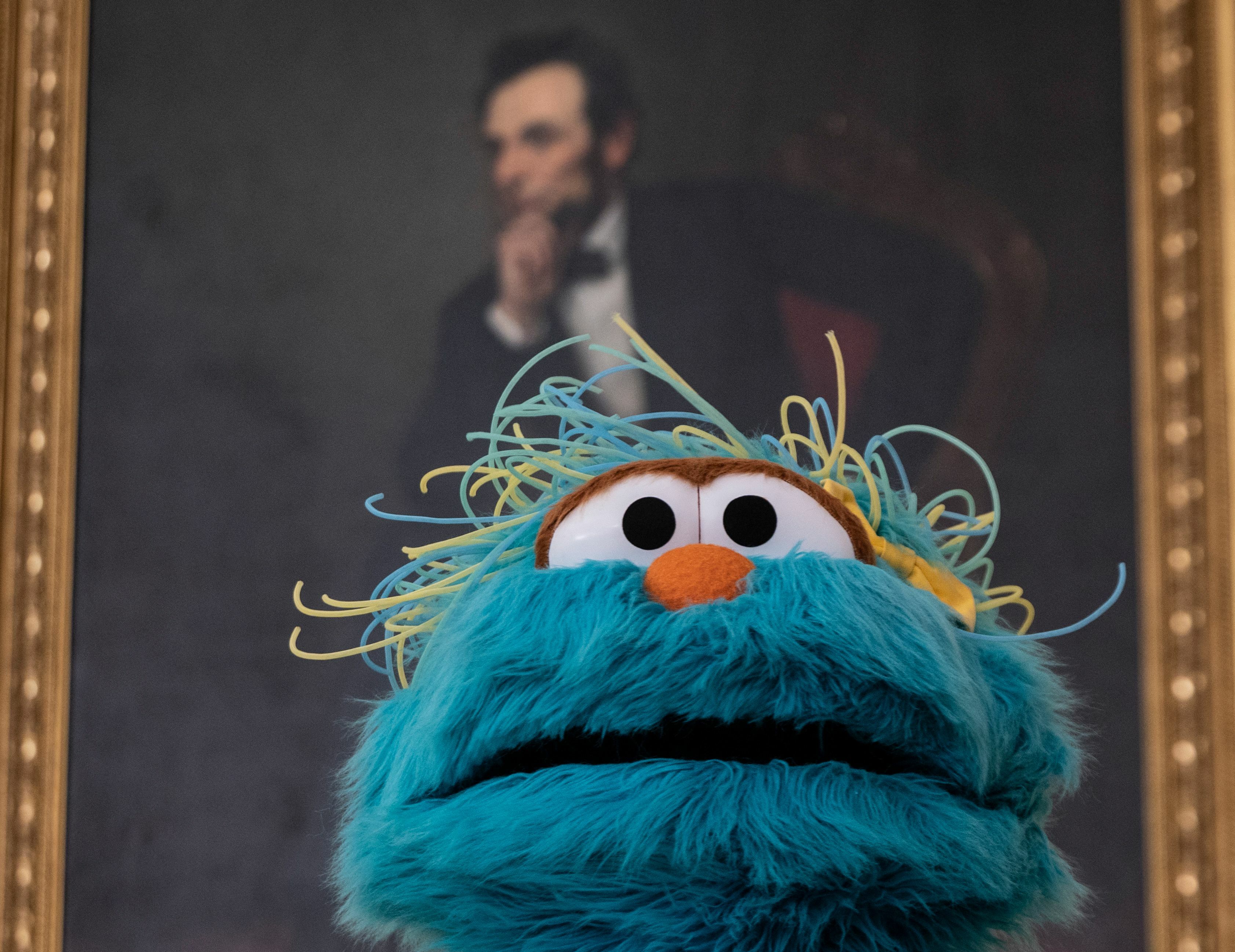 Rosita, a muppet character from Sesame Street, looks on under a painting of Abraham Lincoln during an event in the State Dining Room at the White House in Washington, DC