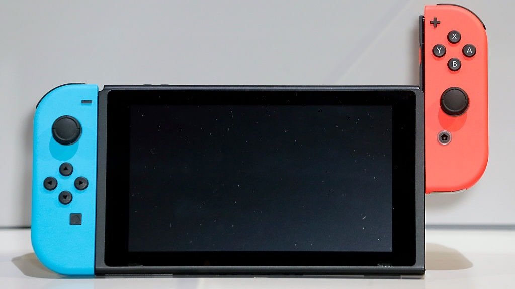 a nintendo switch with gray background
