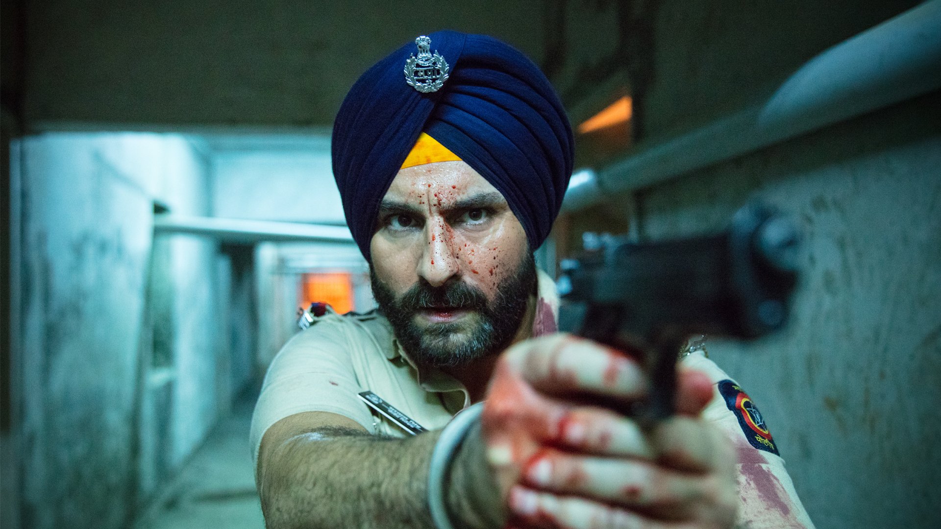 A man points a gun in a hallway.