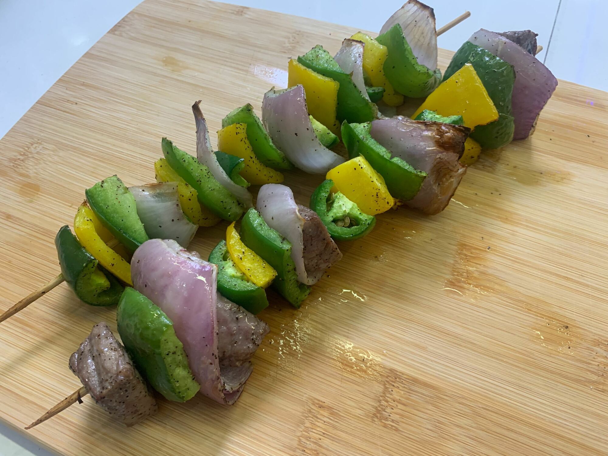 kebabs on a wooden cutting board