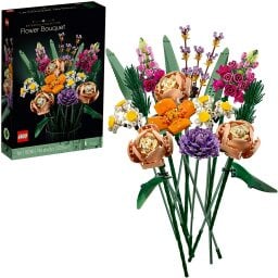 the completed lego flower bouquet next to its box art