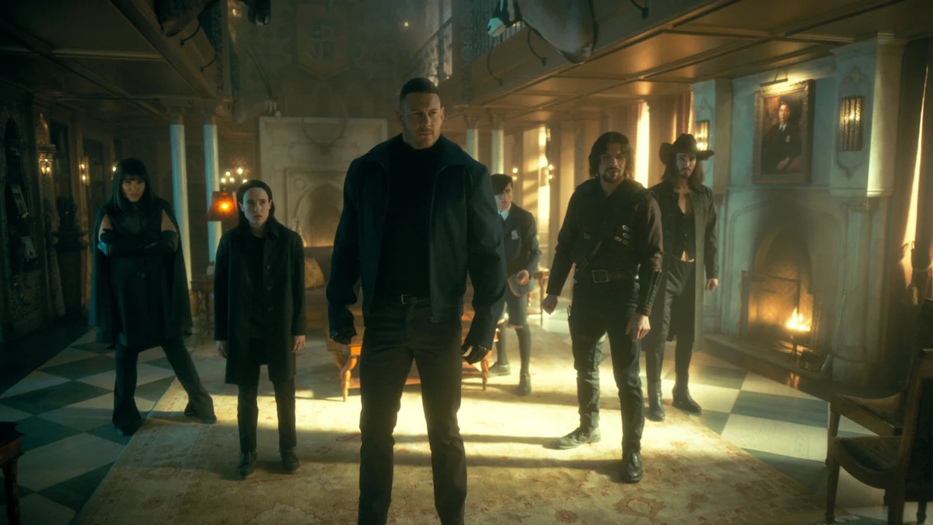 A group of superheroes stand in battle formation in a giant mansion.