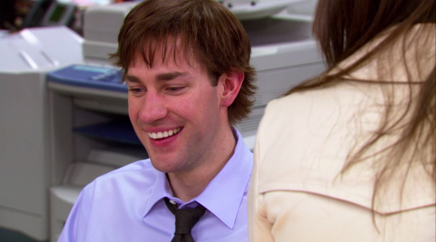 A shot of Jim laughing in the office.