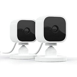 Two white smart security cameras