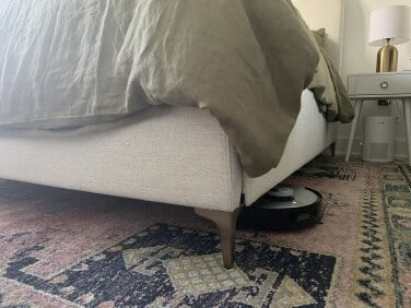 Ecovacs robot vacuum cleaning under bed