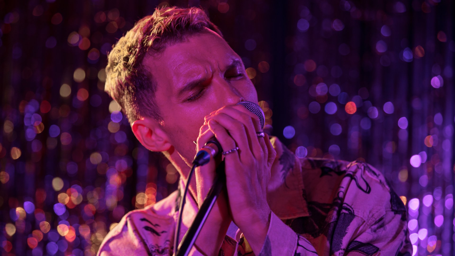 A man singing into a microphone