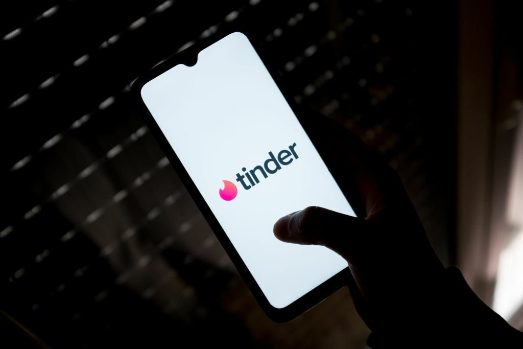 Tinder logo on phone screen