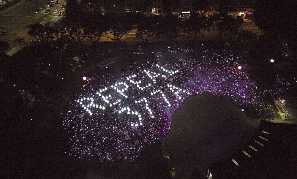 The words 'Repeal 377A' in lights.