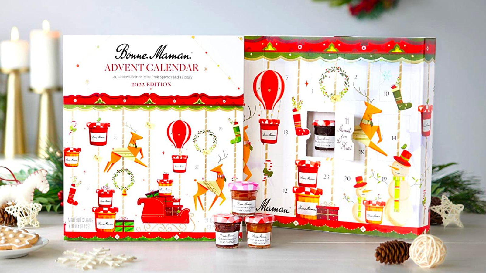 the Bonne Maman 2022 Limited Edition Advent Calendar propped up on a table amid holiday decorations