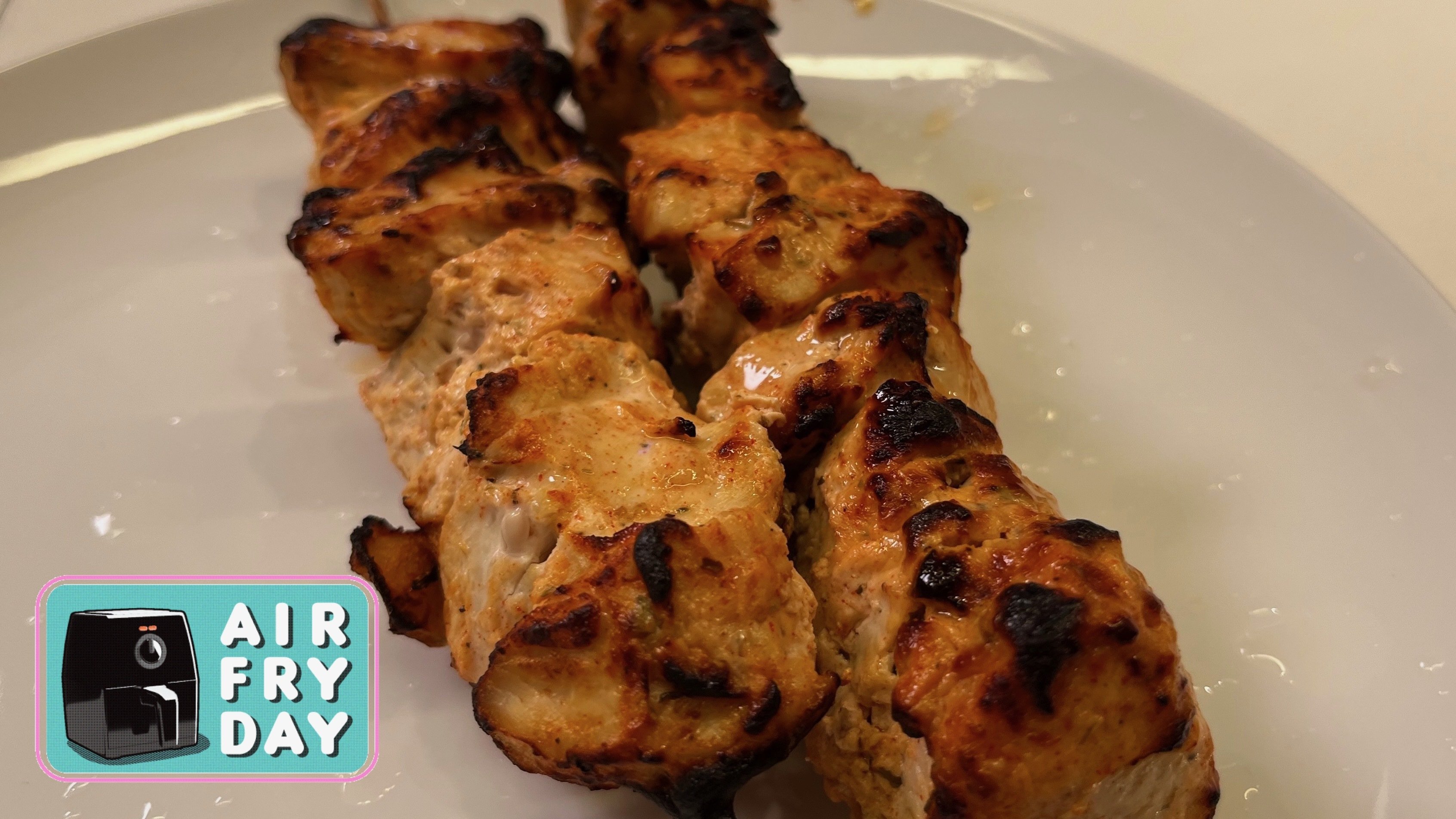 chicken skewers on plate with airfryday logo
