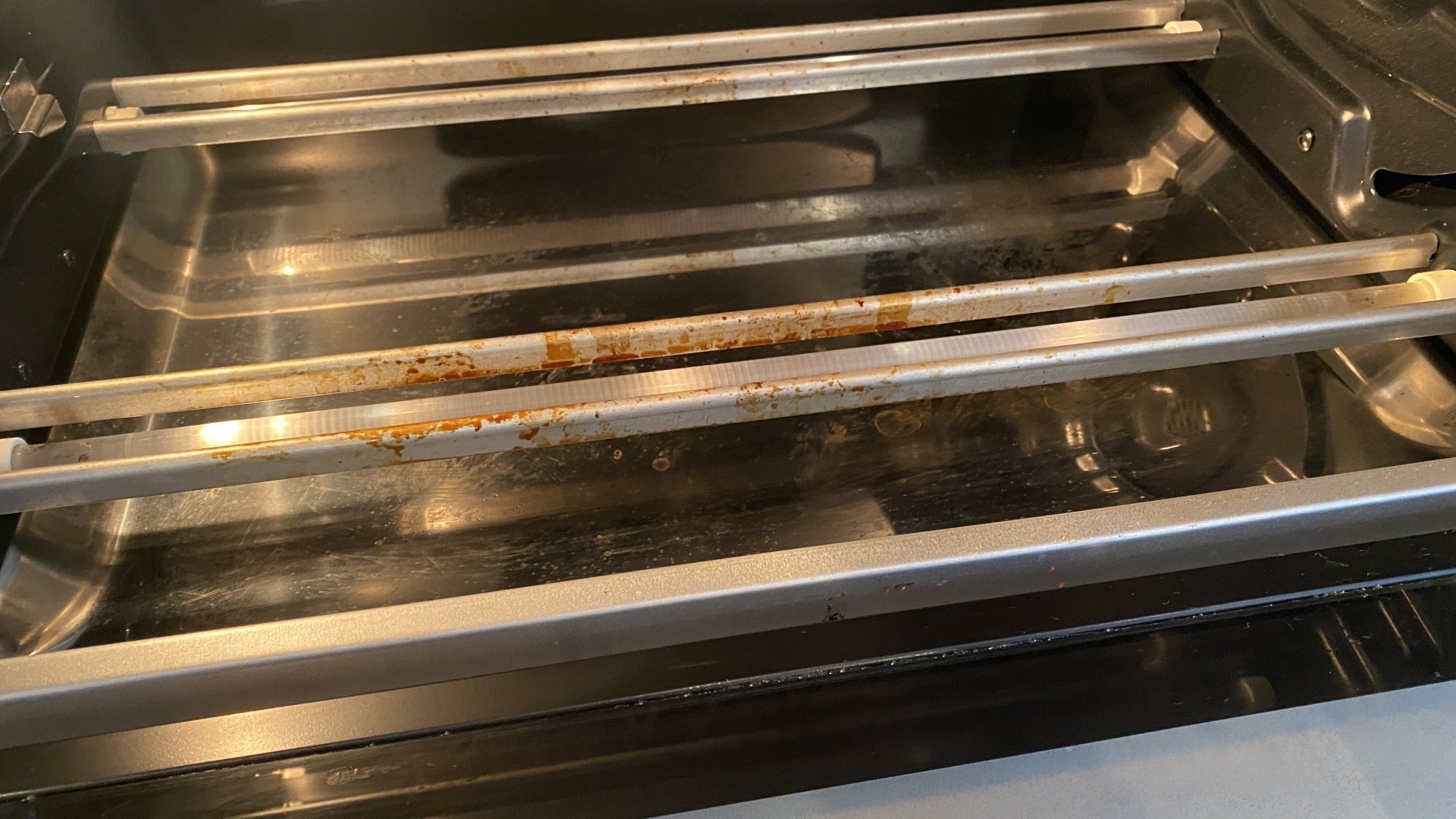 Grease stains from cooking on the inside of a toaster oven