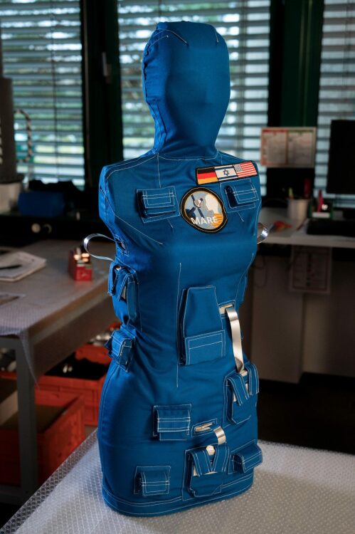 a NASA test flight dummy wearing a radiation protection vest