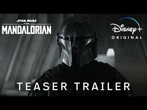 The Mandalorian stands center frame.