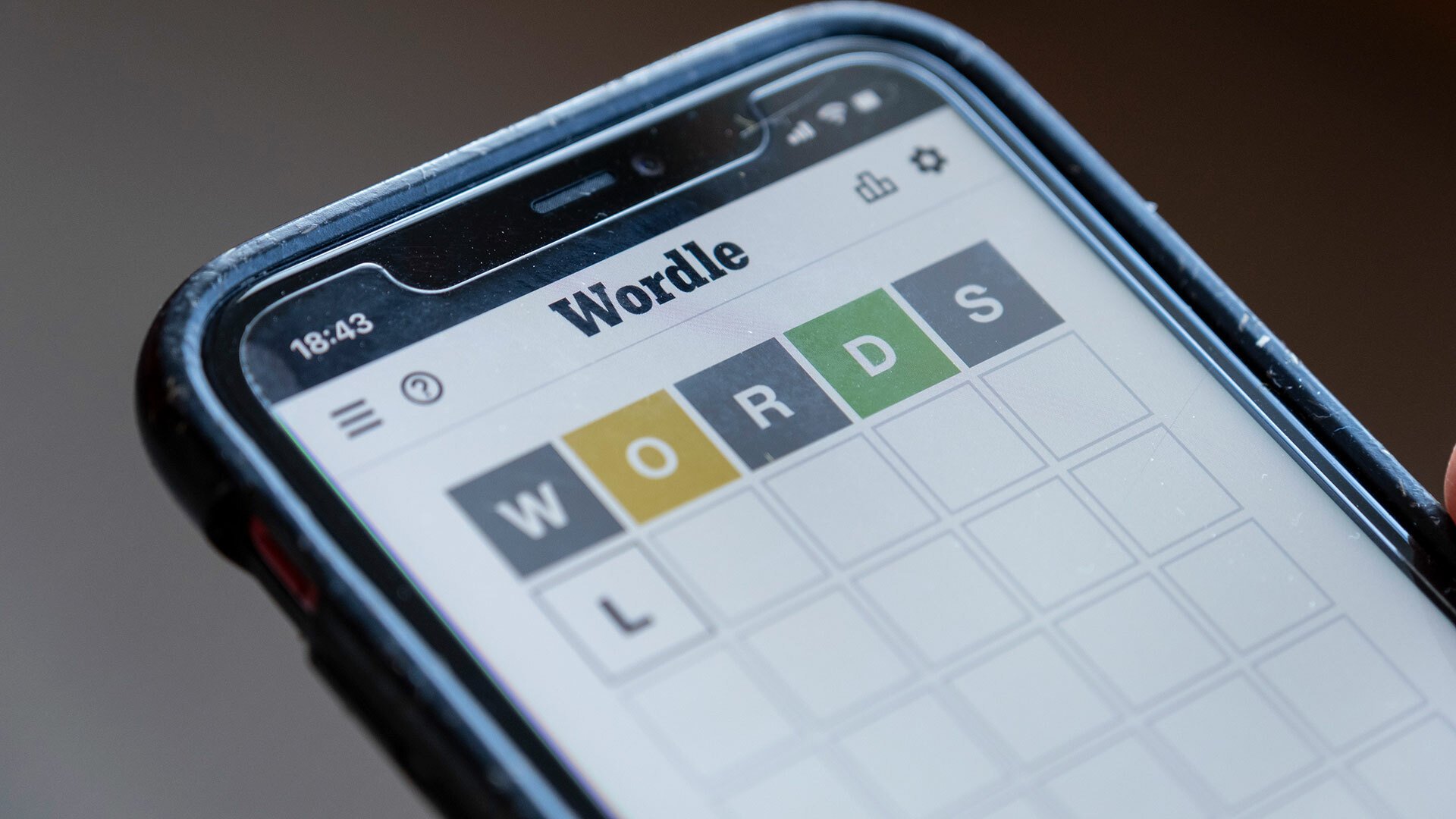 A close-up of someone playing Wordle on a smartphone