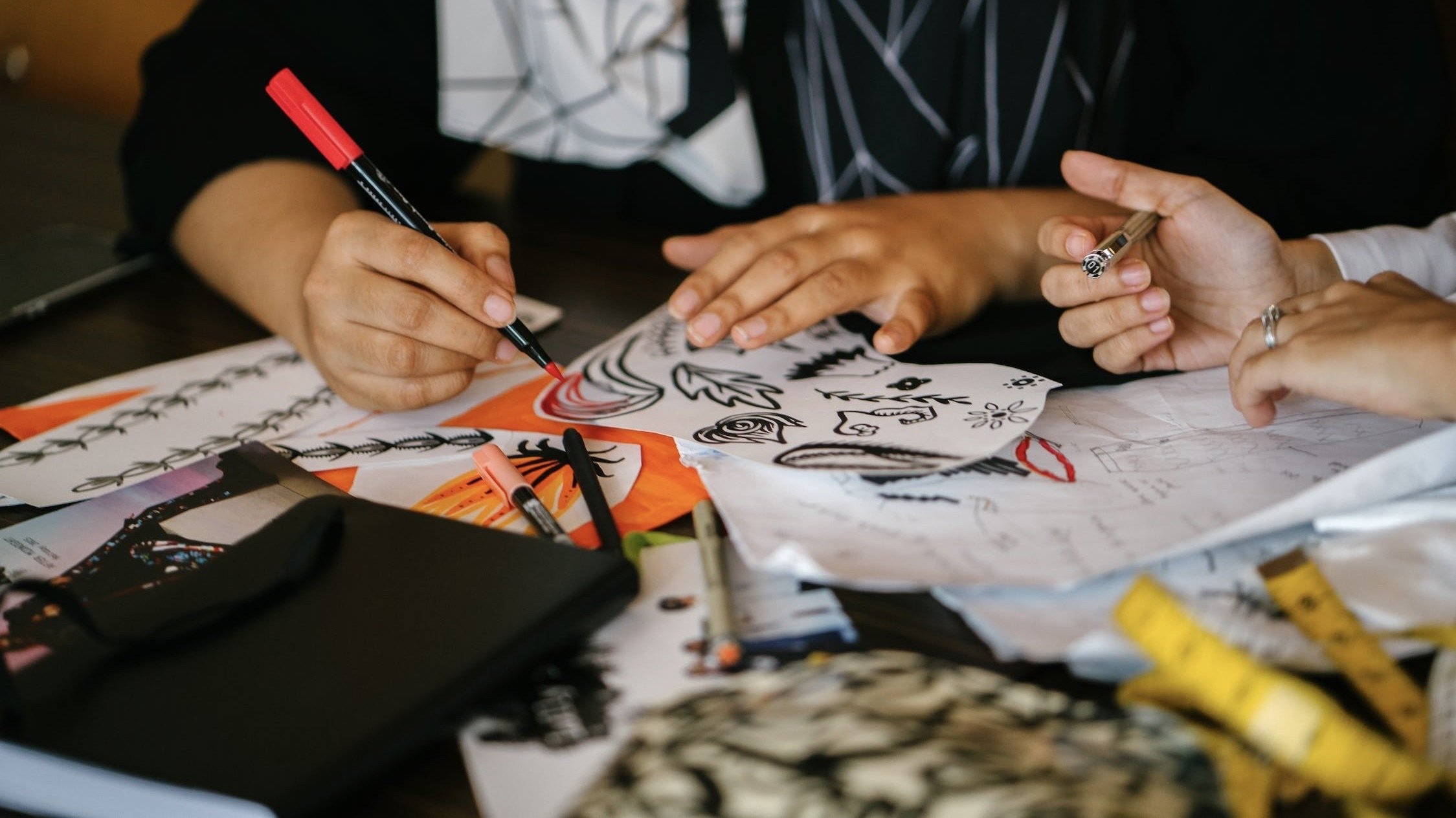 Two people drawing.