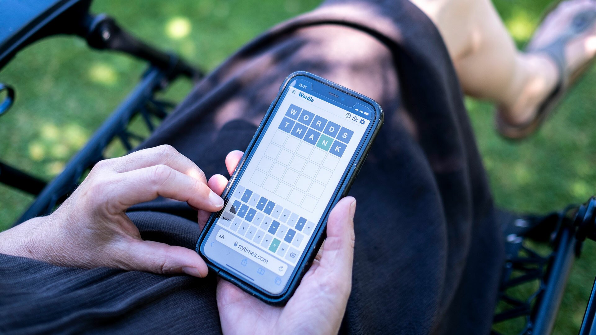A close-up of someone playing Wordle on their smartphone.