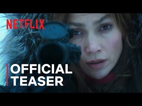 Jennifer Lopez stares down the sight on a sniper rifle