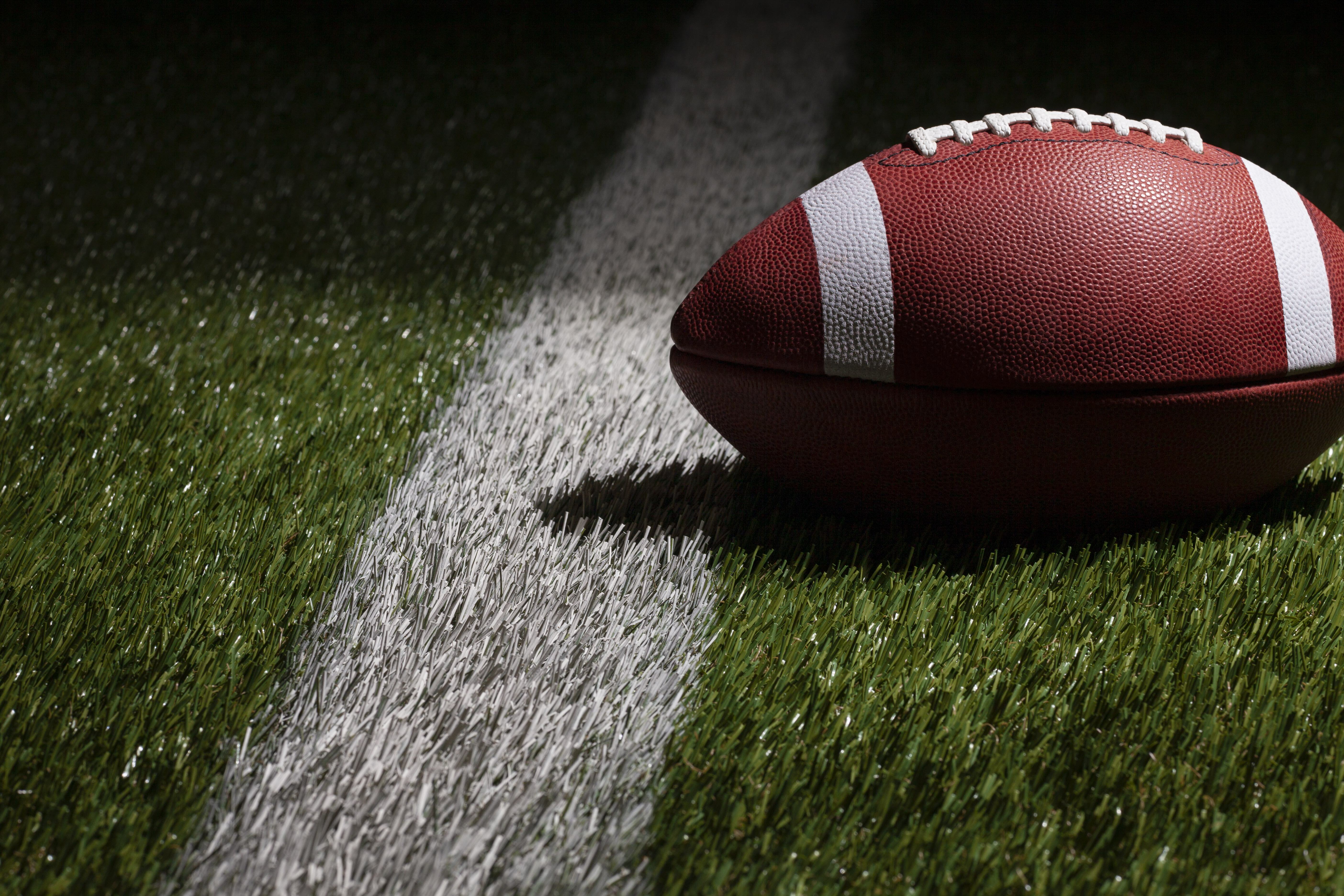 A football on a football field.