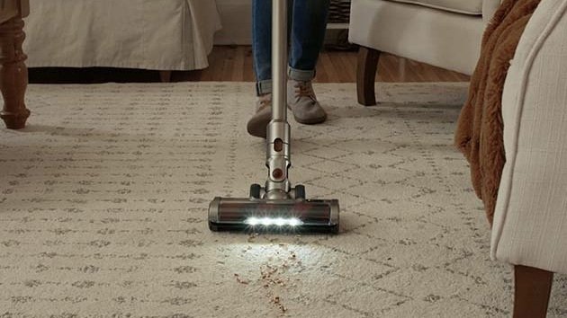 Elicto 5-in-1 Vacuum Spin Mop vacuuming a rug.