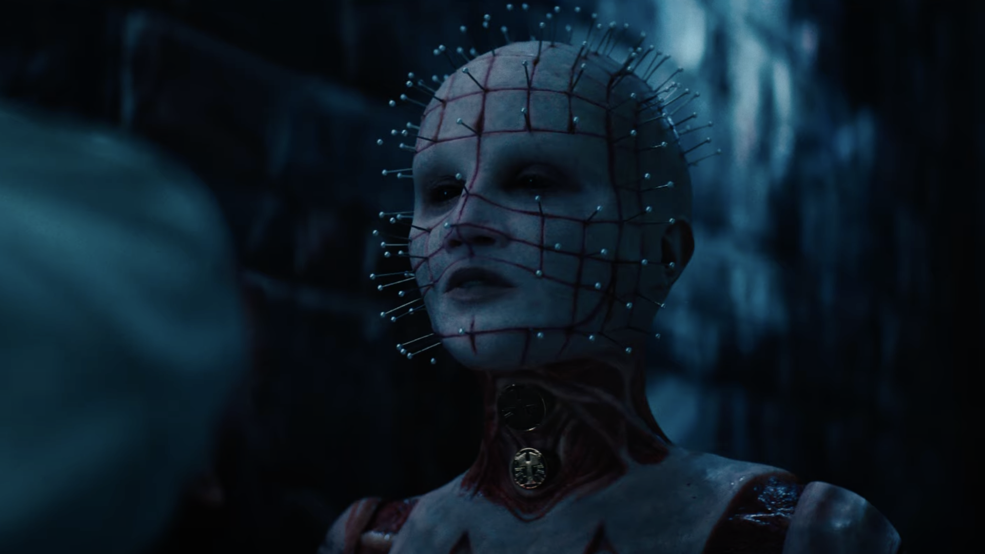 A figure with pins all over its head.