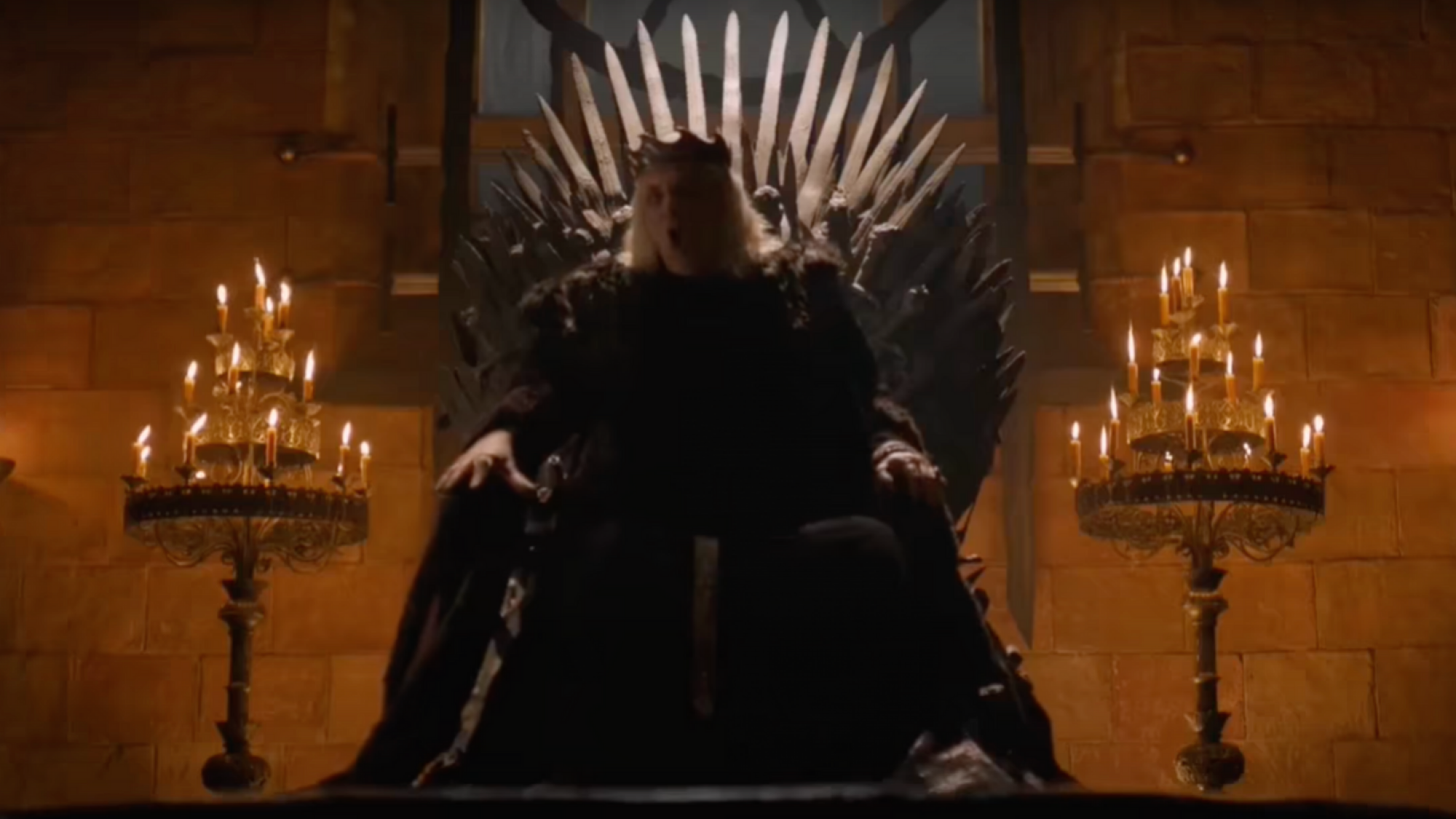 The Mad King sits on the Iron Throne screaming.