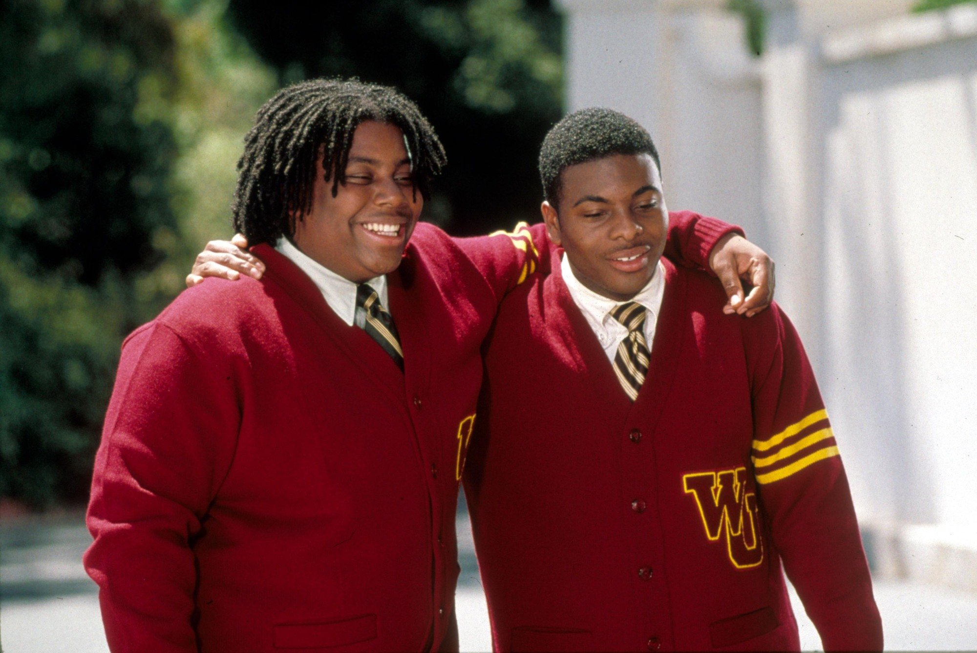 Kenan Thompson and Kel Mitchell wearing watching school sweaters with their arms around each other in "The Adventures of Rocky And Bullwinkle."