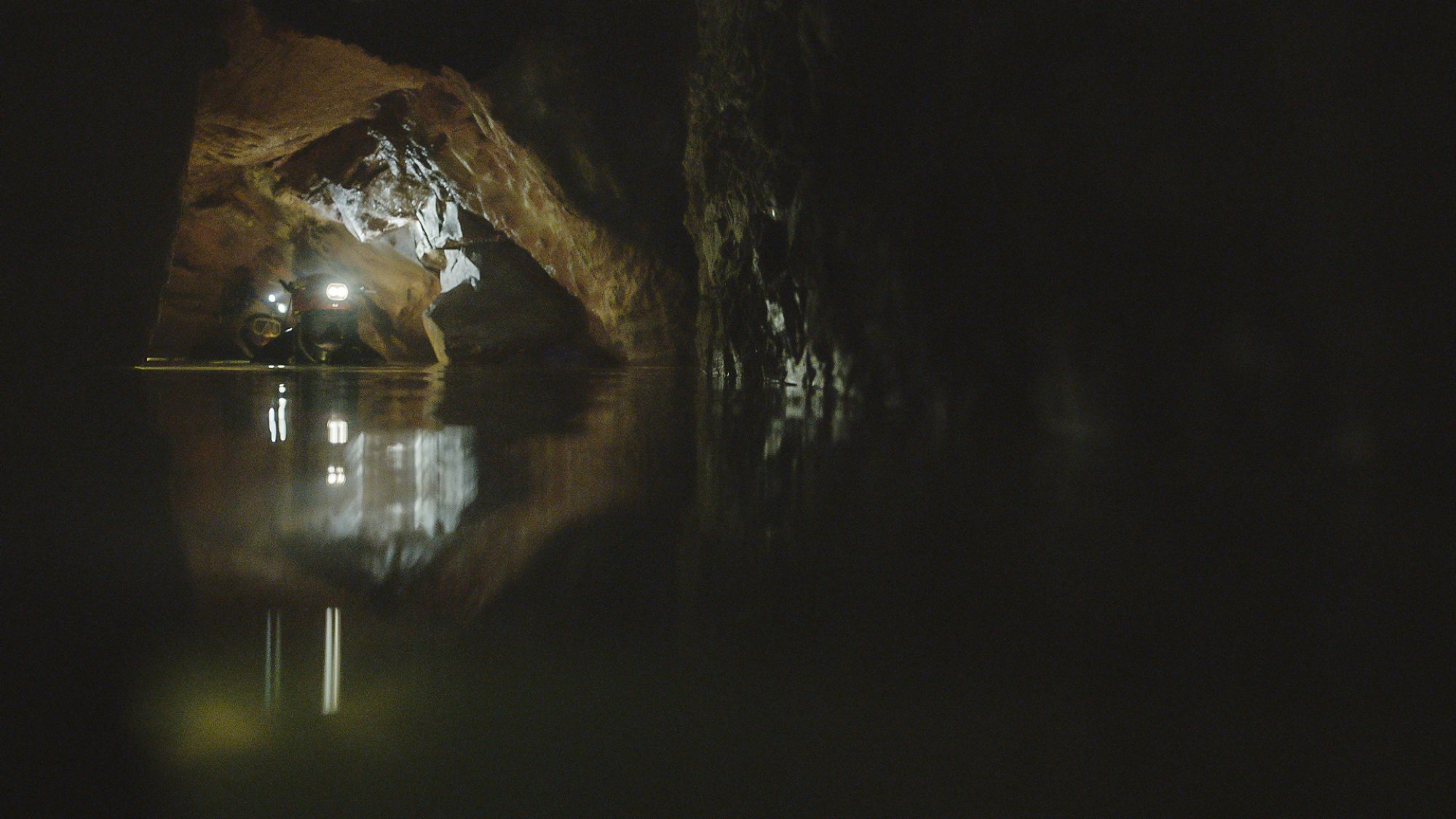 Two divers navigate the cave in northern Thailand where 12 boys and their football coach were trapped.