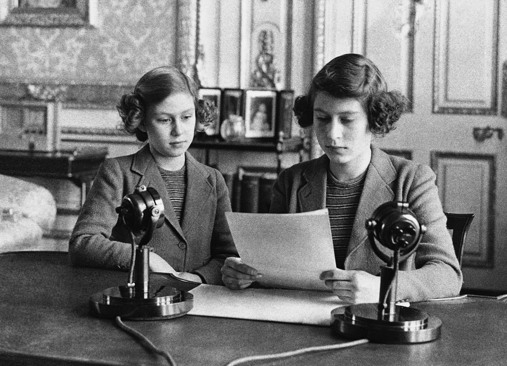 In her first radio broadcast, 14-year-old Princess Princes Elizabeth shown making her first radio broadcast with her younger sister, Princess Margaret Rose, in London on Oct. 13, 1940.