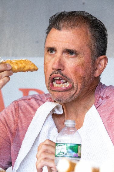 Contestant Eating Cannoli