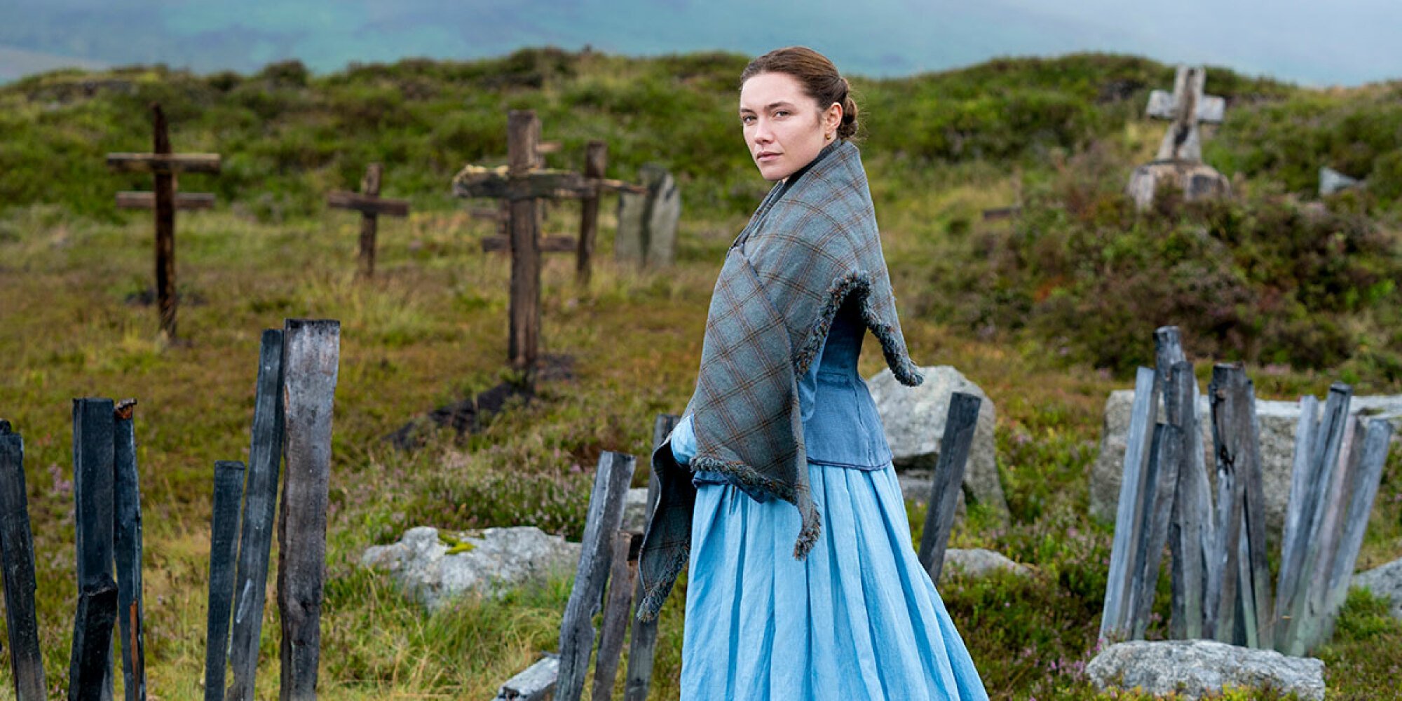 Florence Pugh smirks in 1800s costume in "The Wonder."