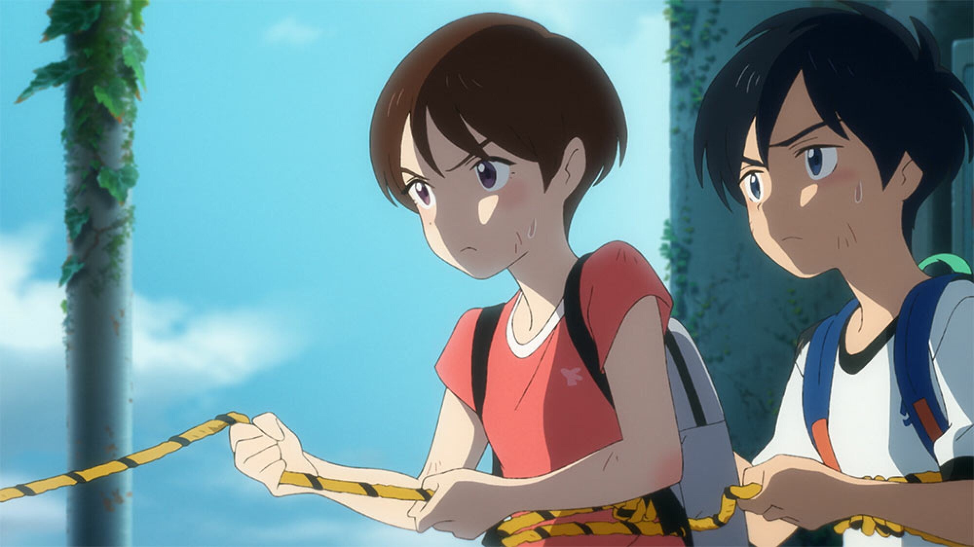 A girl and a boy pull on a rope.