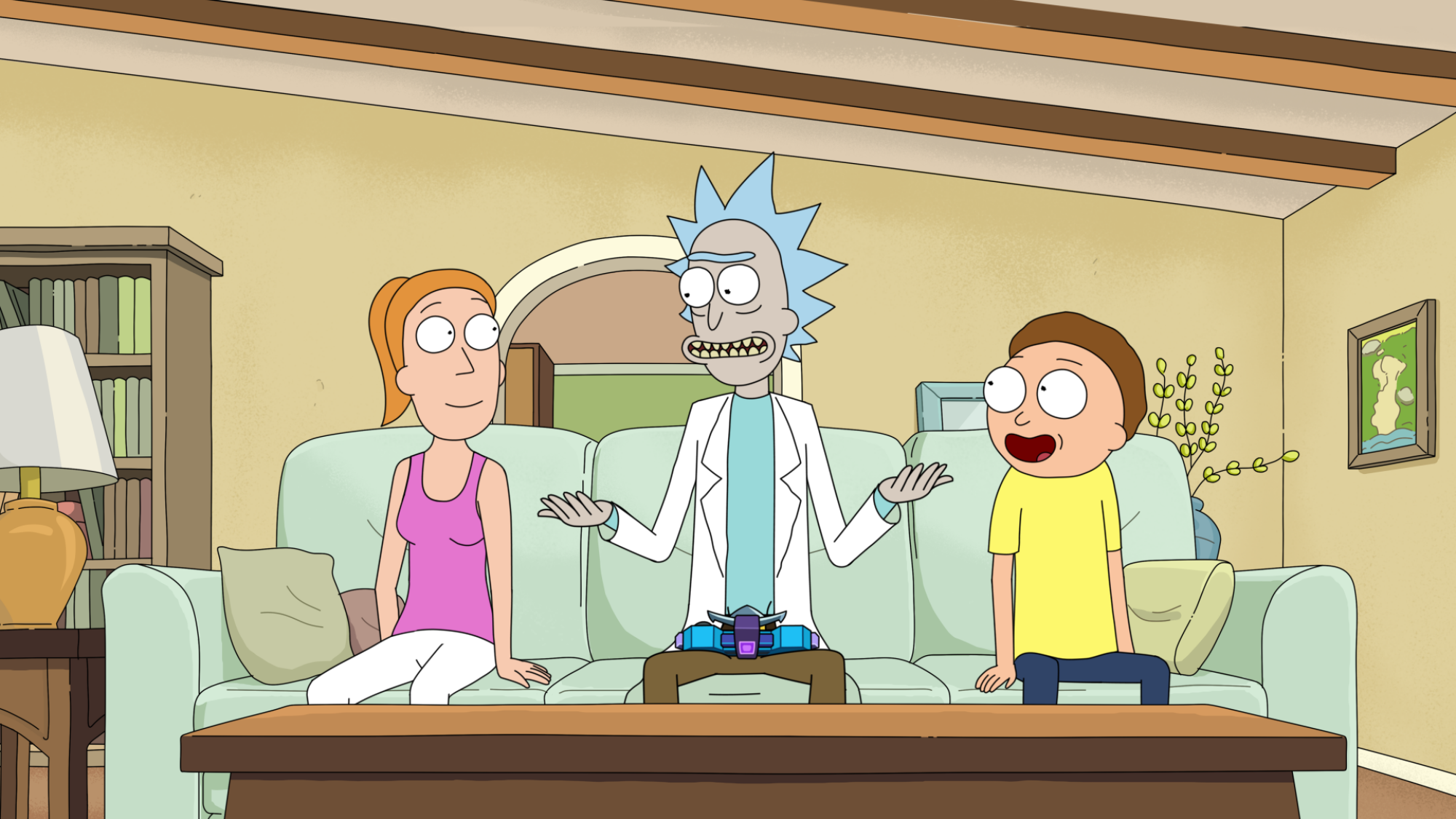 Rick sits on the couch with Summer and Morty.