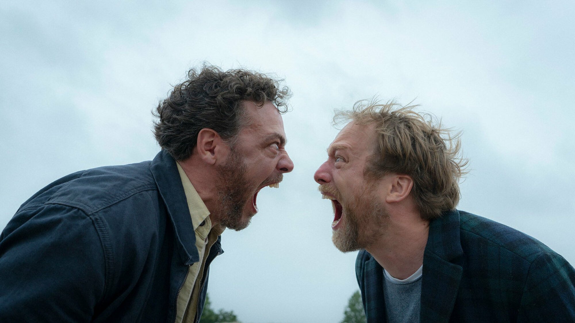 Two men scream at each other.