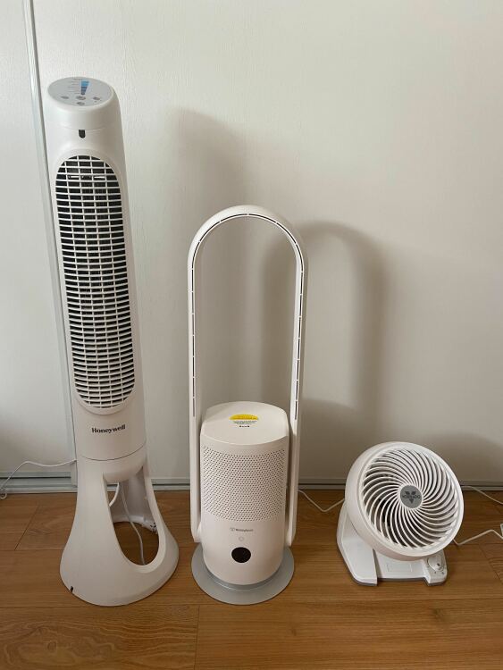 honeywell fan, westinghouse fan, and vornado next to each other