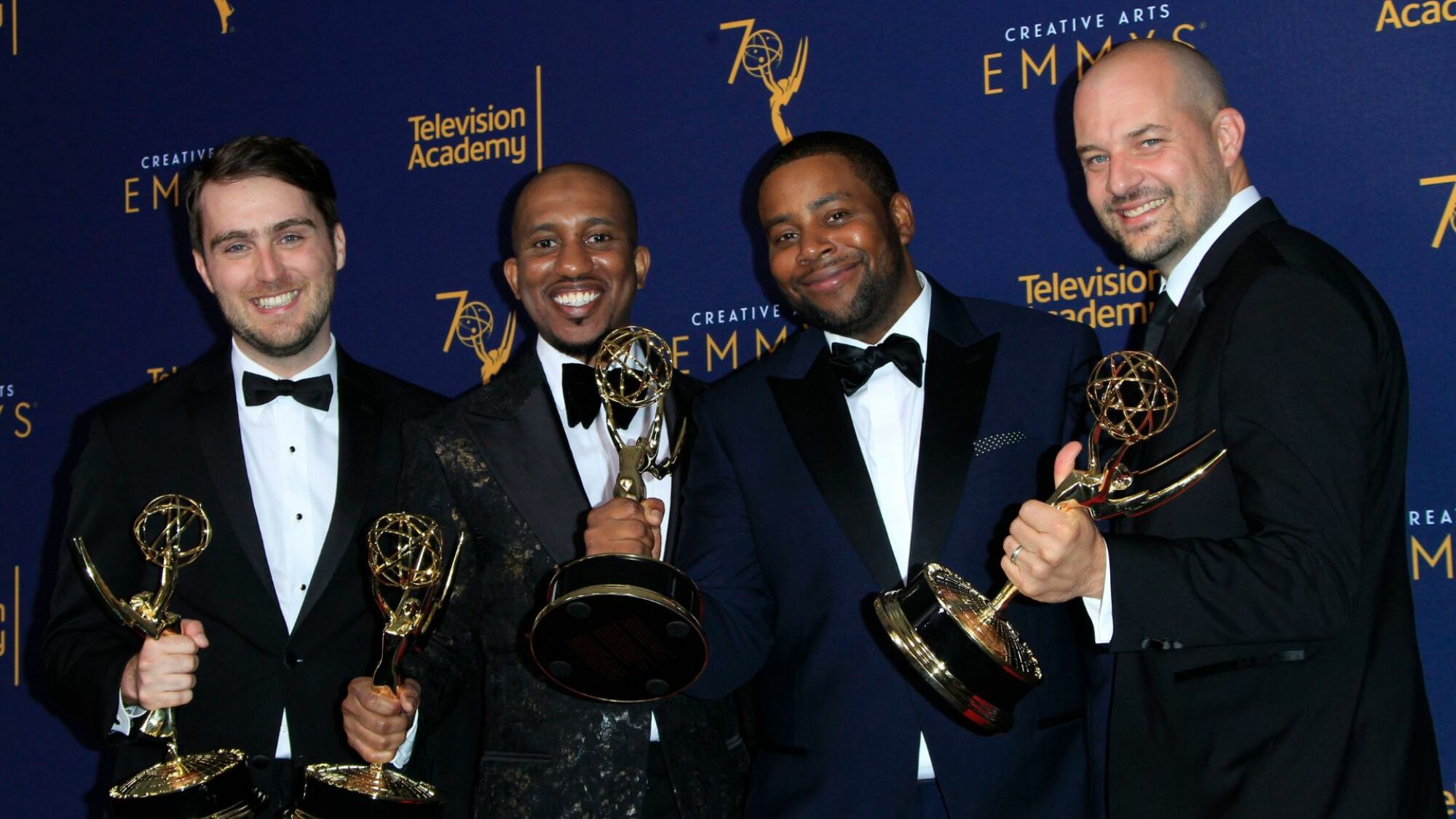 Will Stephen, Chris Redd, Kenan Thompson, and Eli Brueggemann hold the Emmy for Outstanding Original Music and Lyrics for "SNL" during the 2018 Creative Arts Emmy Awards at the Microsoft Theater in Los Angeles, California, on September 2018.