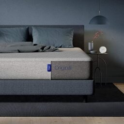 Mattress on a blue bed frame
