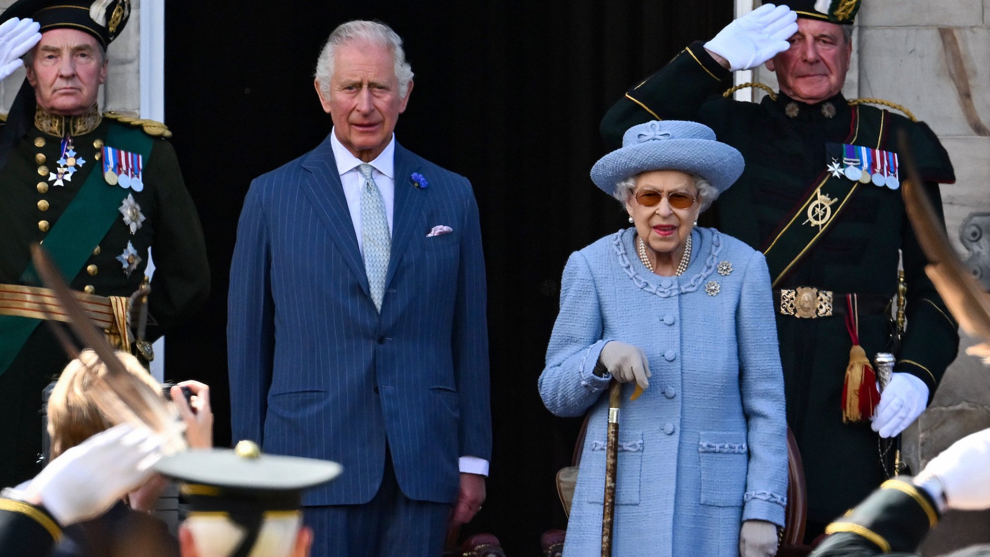 Prince Charles, Prince of Wales, known as the Duke of Rothesay while in Scotland, and Queen Elizabeth II attend the Royal Company of Archers Reddendo Parade in the gardens of the Palace of Holyroodhouse.