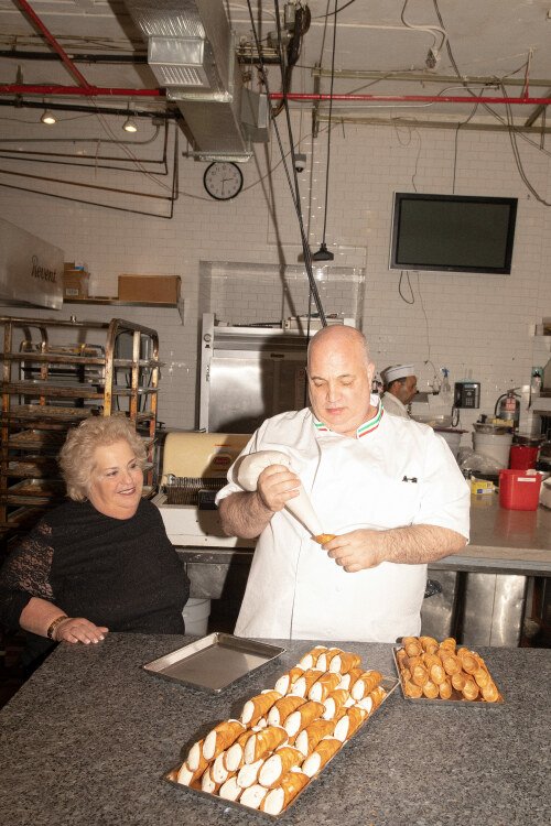 Ernest and Adeline making cannoli.
