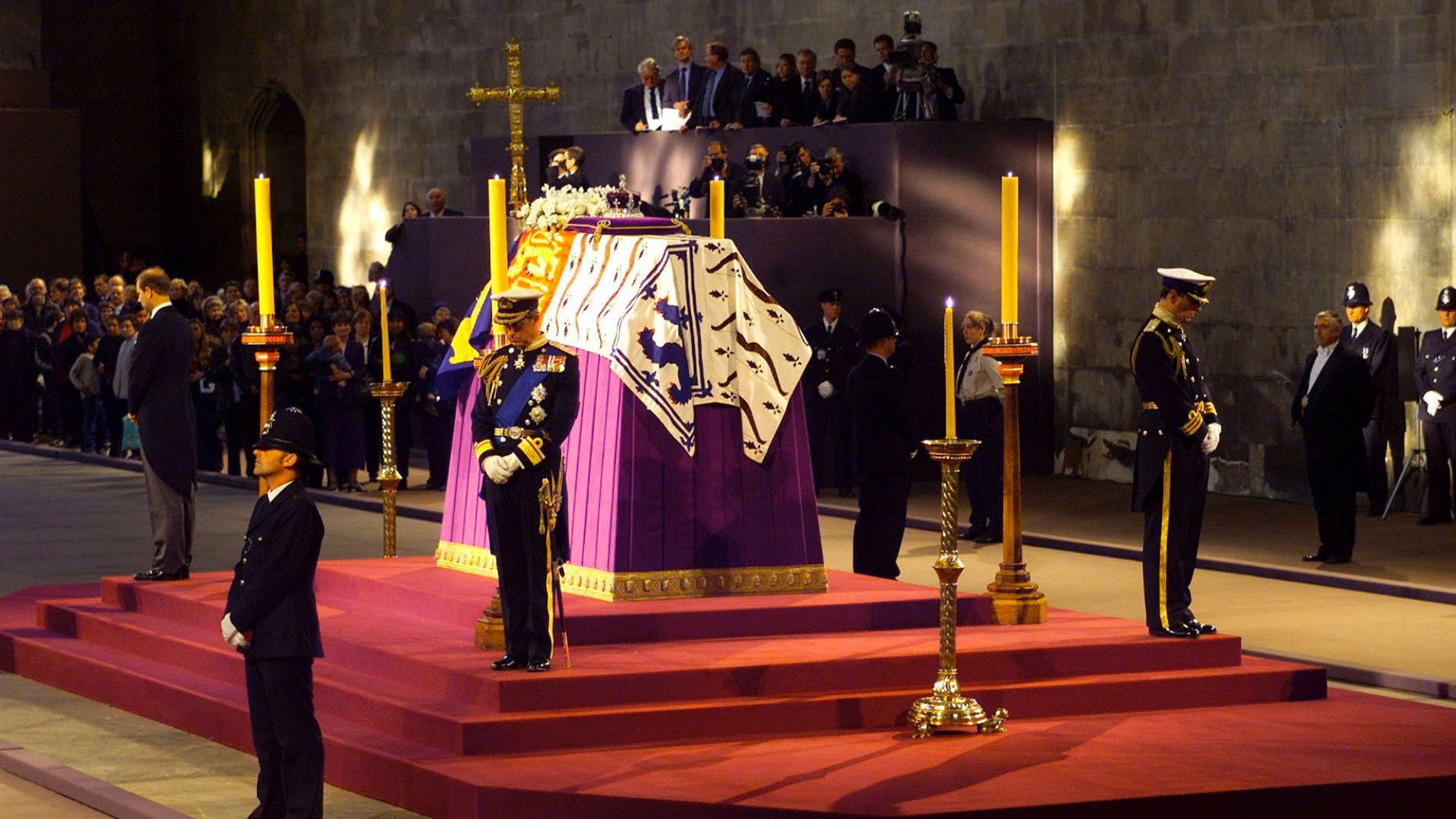 Prince Charles of Britain stands in vigil at the coffin of his grandmother the Queen Mother as it lies in state April 8, 2002 in Westminster Hall, London