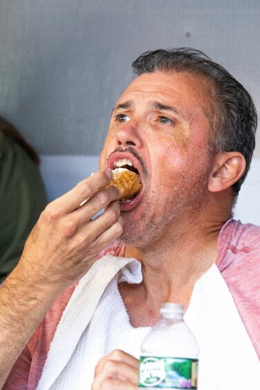 Contestant Eating Cannoli