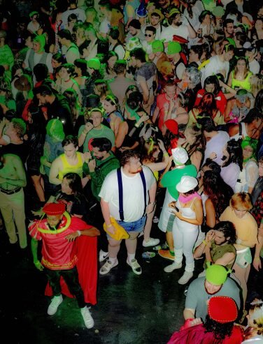 crowd of shrek rave in costume and dancing